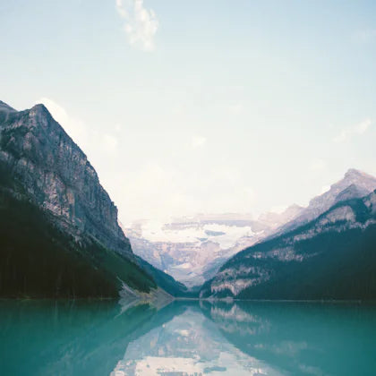 Turquoise mountain lake between tall mountains