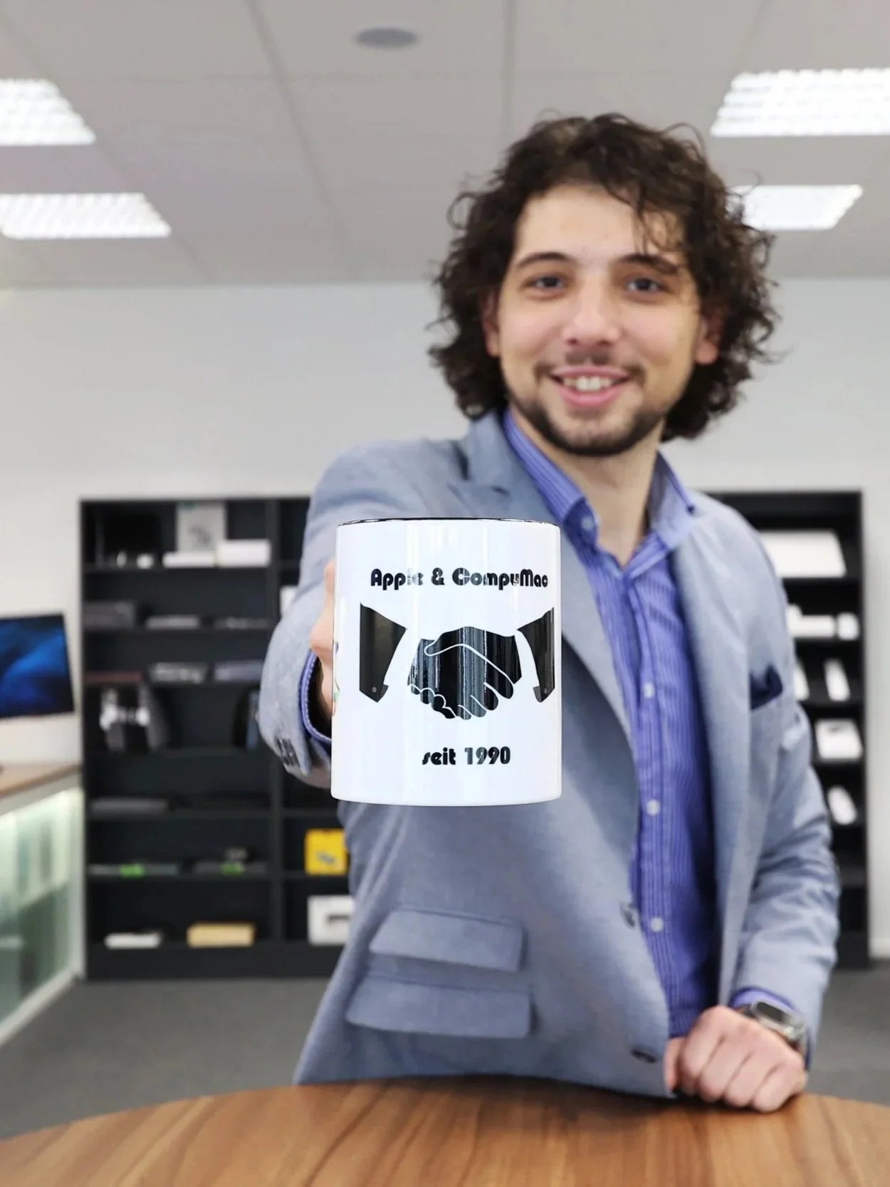 Todi Vasilia in the CompuMac store
