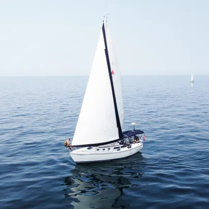 White sailboat on a lake